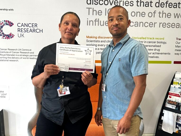 A JR&Co Star awarded a certificate of appreciation from their client